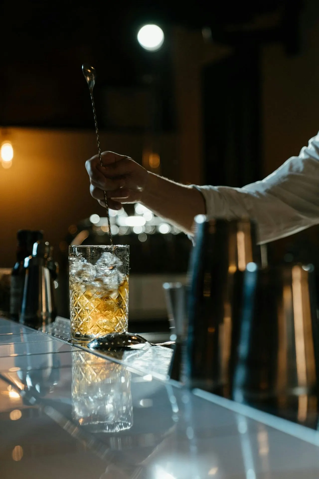 Bartender preparing a drink in a licensed bar - PC Licensing Consultancy