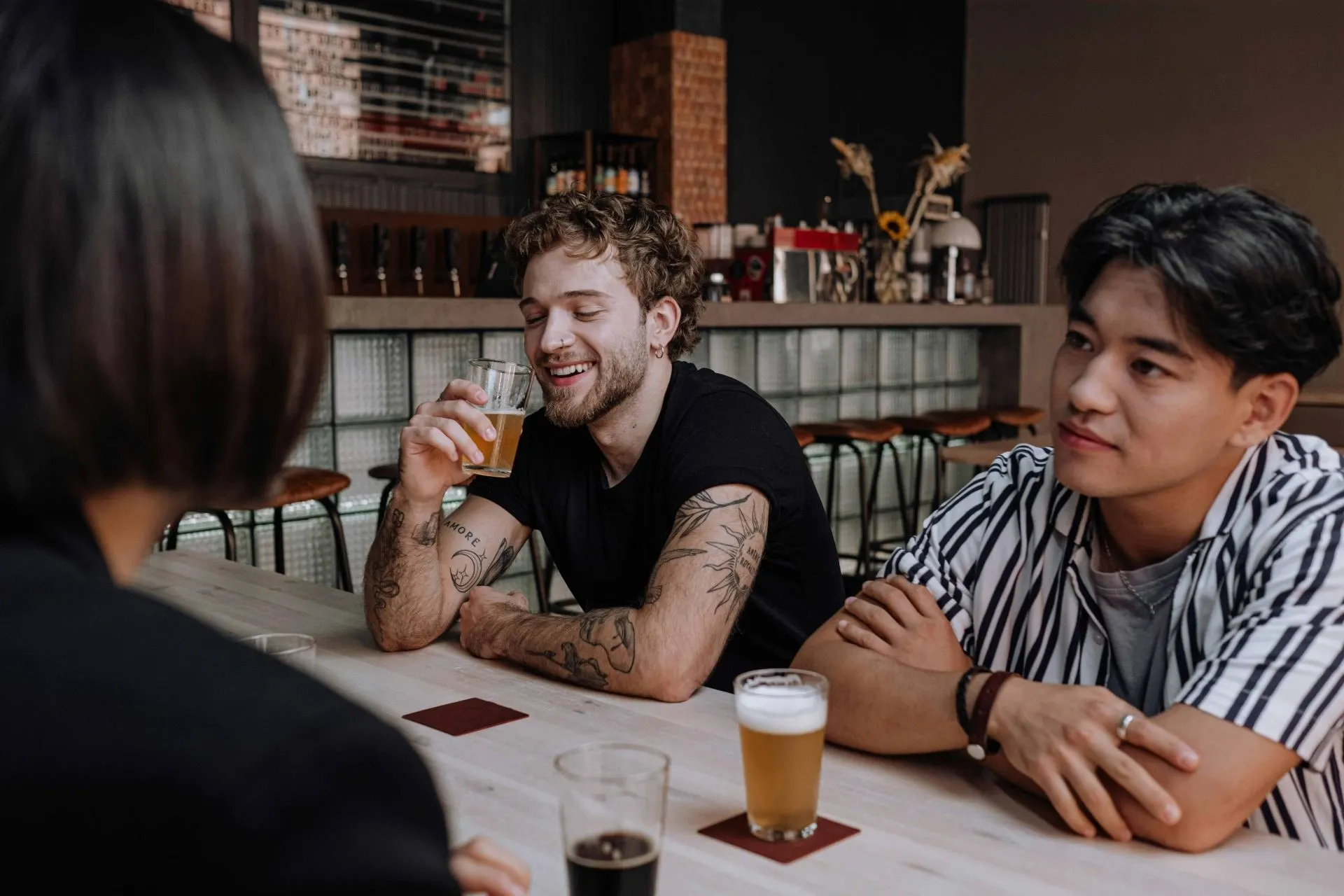 Customers at the bar of a busy licensed venue - PC Licensing Consultancy