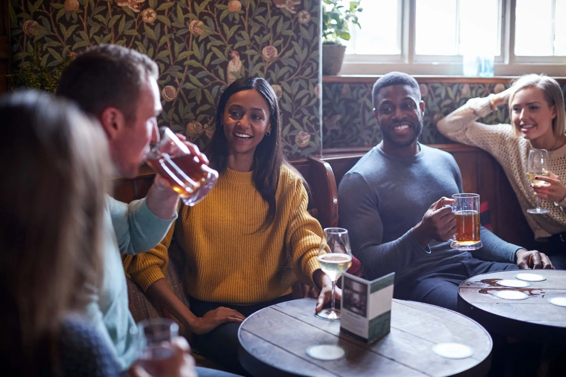 Friends enjoying lunchtime drinks in a licensed pub - PC Licensing Consultancy