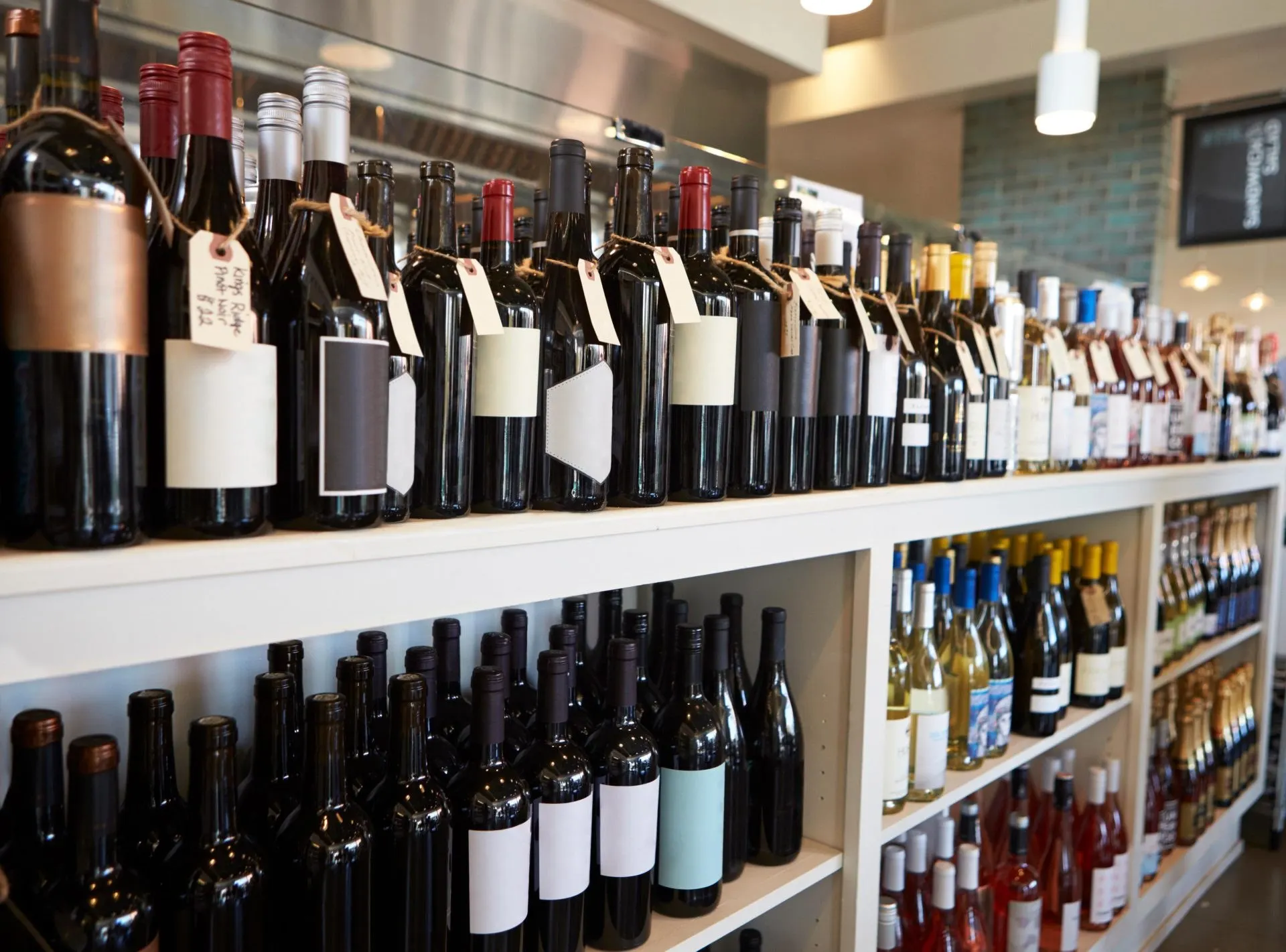 Bottles of wine on display in a licensed delicatessen - PC Licensing Consultancy associates